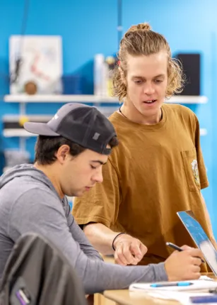 Two students work together on a project