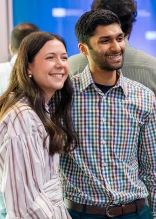 Two students smile for a photo in Girard Innovation Hall