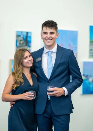 Two students pose for a photo