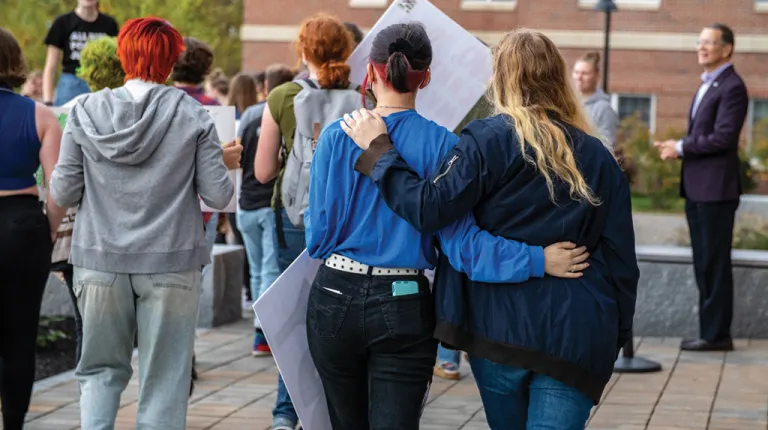 Two U N E students standing together at the Women's March 2021