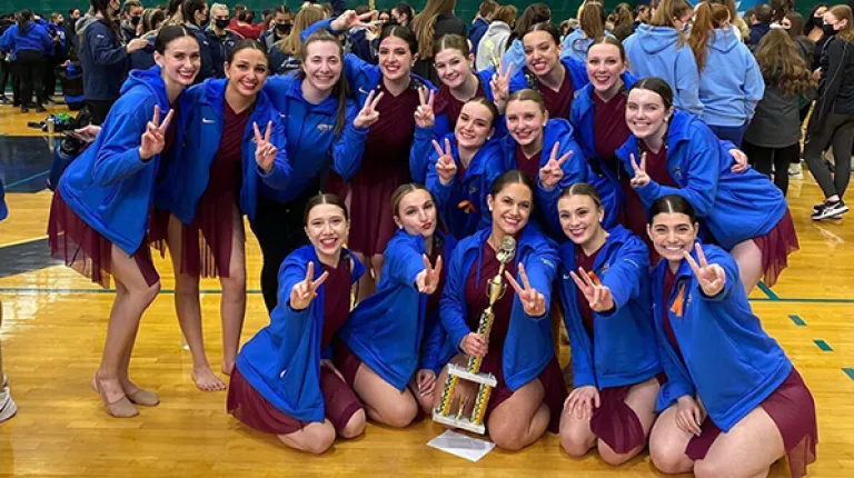 UNE women's dance team poses for a photo