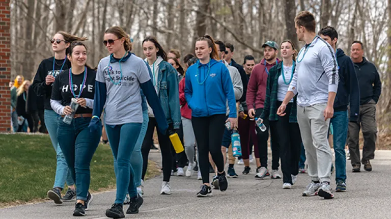 Students walk at the Out of the Darkness March