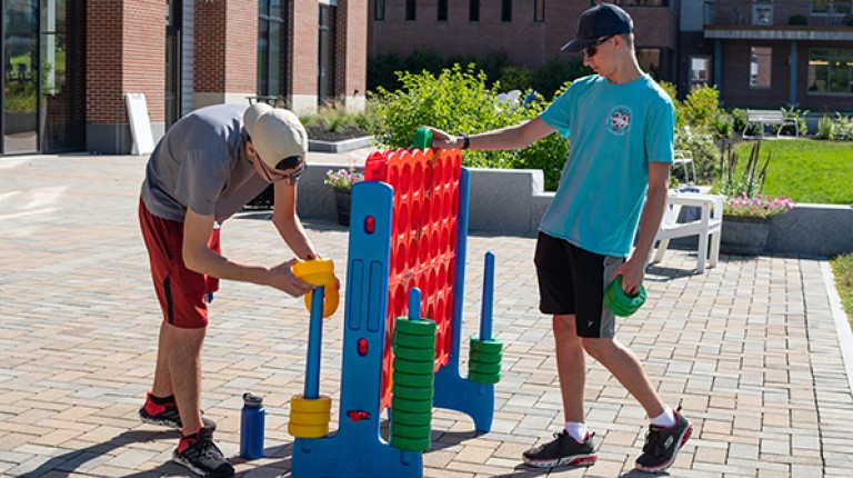 Students play a large connect-4 game