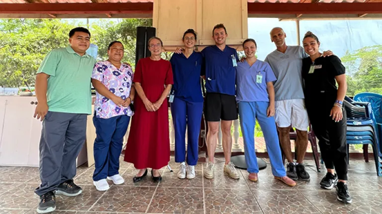 Ana Maria Castellanos poses with her clinical group