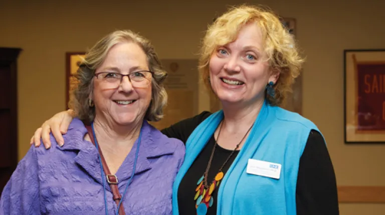 Lynn Brandsma and an individual pose together