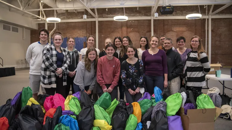 Students pose with harm reduction kits