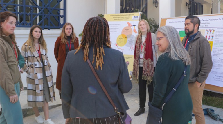 Photo of U N E P T students during a poster session at the O T Morocco conference