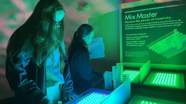 Students play with a sound mixer