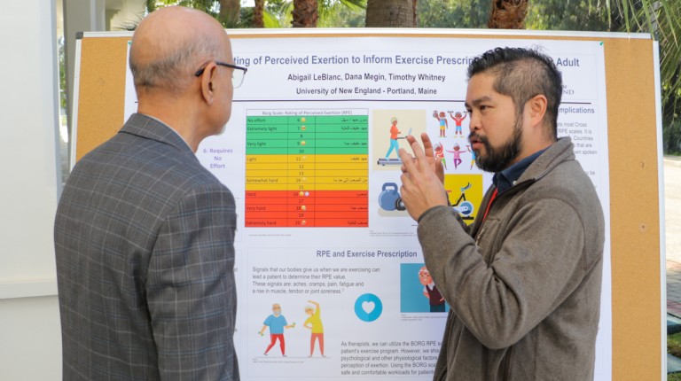 A student presents their poster as part of the 5th Annual Conference of the Occupational Therapy Association of Morocco
