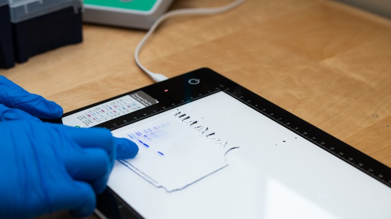 An iPad displays scientific data onscreen