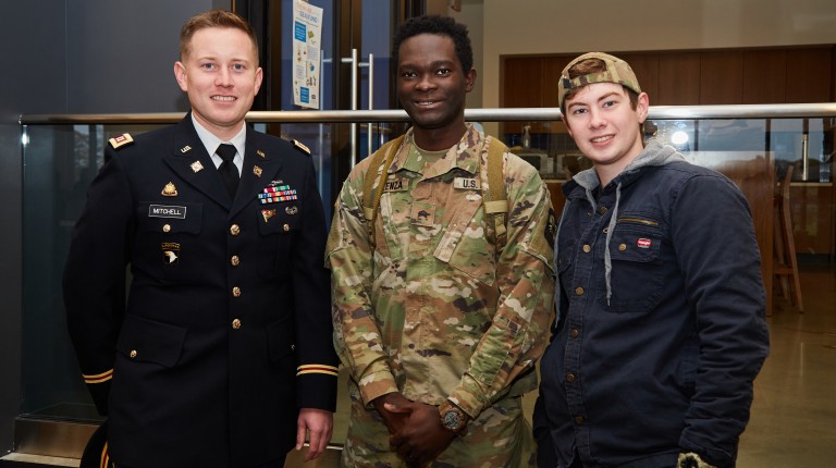 ROTC and Navy students pose for a photo