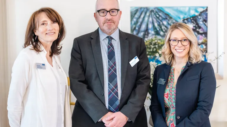 Three Pharmacy professors pose for a photo