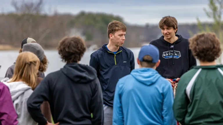 UNE students give instructions to a group of teens