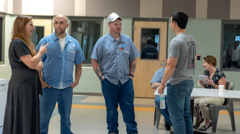 Trisha Mason talks with residents of the Maine Correctional Center. 