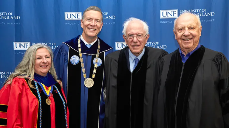 Gwendolyn Mahon and James Herbert with the tow honorary degree recipients Bernie Sanders and Arthur P. Girard