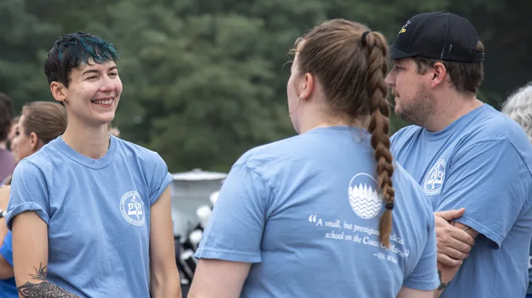 A group of U N E employees hanging out after an annual Fun Run