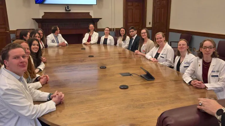 UNE and Tufts medical students pose for a photo in the Governor's conference room