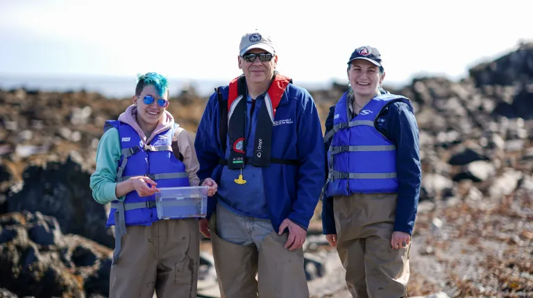 UNE student researchers and Markus Frederich pose for a portrait on Ram Island