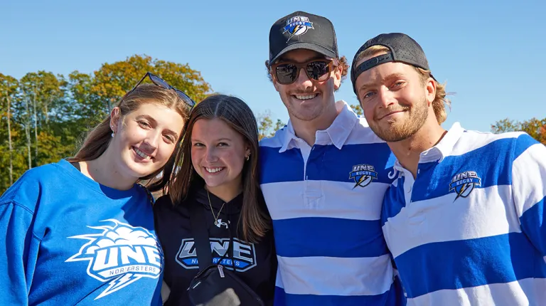 Four students pose together for the camera