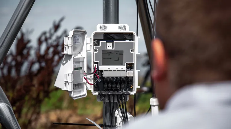 Assistant Professor WIll Kochtitzy inspects the sensor control panel
