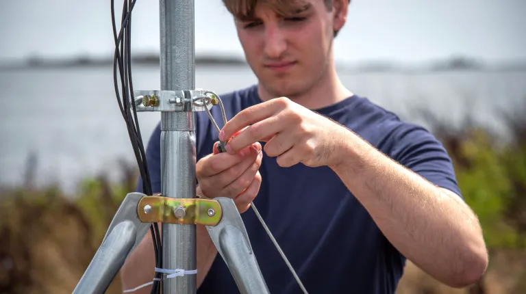 Janik secures the station using a guy wire