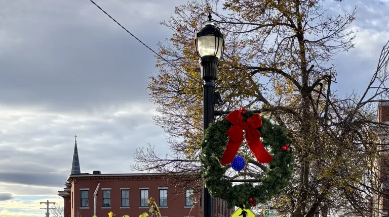 Since 2017, the University of New England students have volunteered to help the Heart of Biddeford non-profit decorate downtown Biddeford with holiday lights. This year, the light brigade showed up in force on Nov. 16 as 28 students climbed ladders up and down Main Street to help hang lights and decorate the town for the holidays.