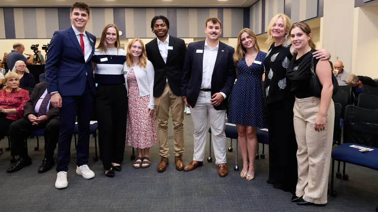 Brayden Bashaw; Olivia Chase; Sarah Rossignol; Kimman Power; Tyler Pelletier; Emme Perry; First Lady Lynn Brandsma, Ph.D; and Sydney Bishop pose at the 2025 President's Forum