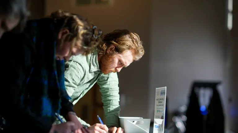 PEOPLE WRITING CARDS