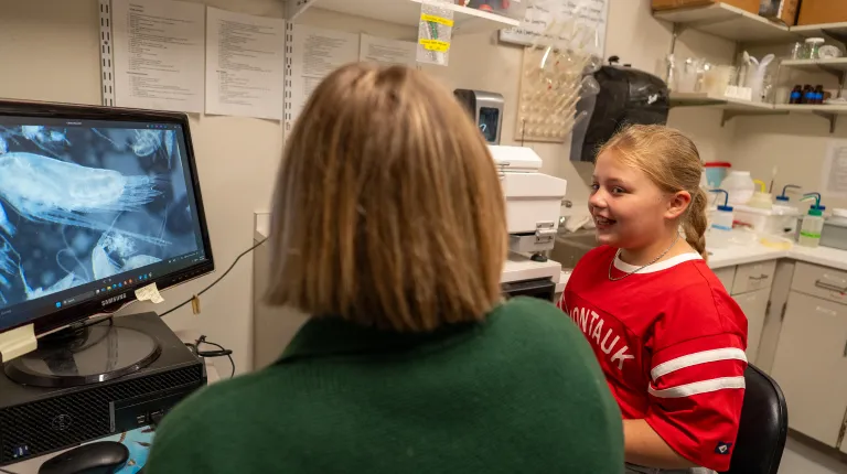 Assistant Professor Tricia Thibodeau and third-year marine science major Piper Stagg took time to lead a private tour of the Arthur P. Girard Marine Science Center for a 10-year-old aspiring researcher, carrying on a legacy of discovery throughout the next generation of scientists.