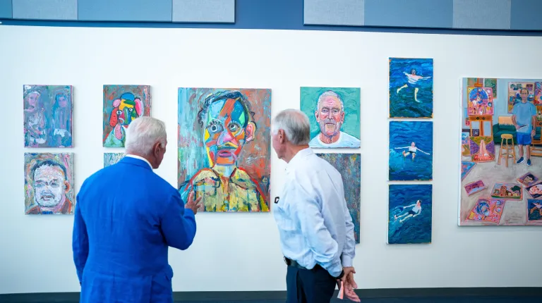 Spectators view gallery artwork