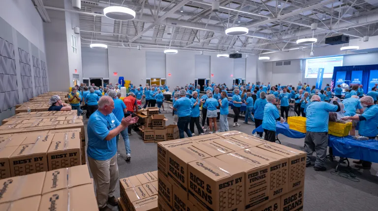  UNE, community volunteers pack a record 200,000 meal kits to combat hunger across Maine