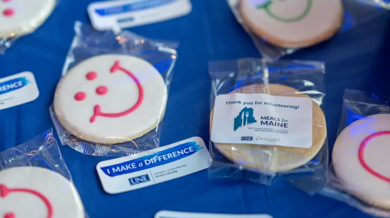 UNE, community volunteers pack a record 200,000 meal kits to combat hunger across Maine