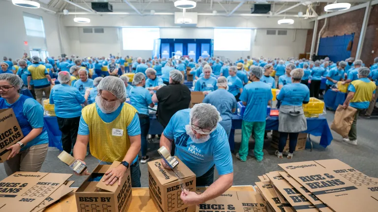  UNE, community volunteers pack a record 200,000 meal kits to combat hunger across Maine