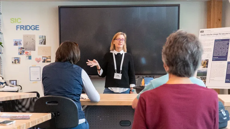 UNE's Lisa Herschbach speaks to a group