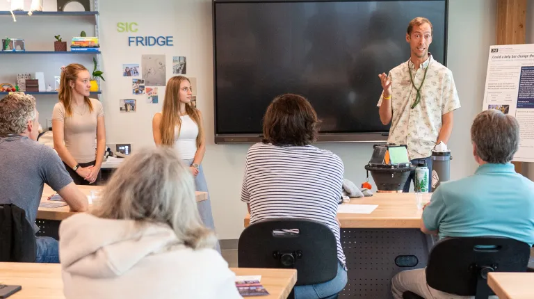 UNE's Michael Duddy addresses a crowd