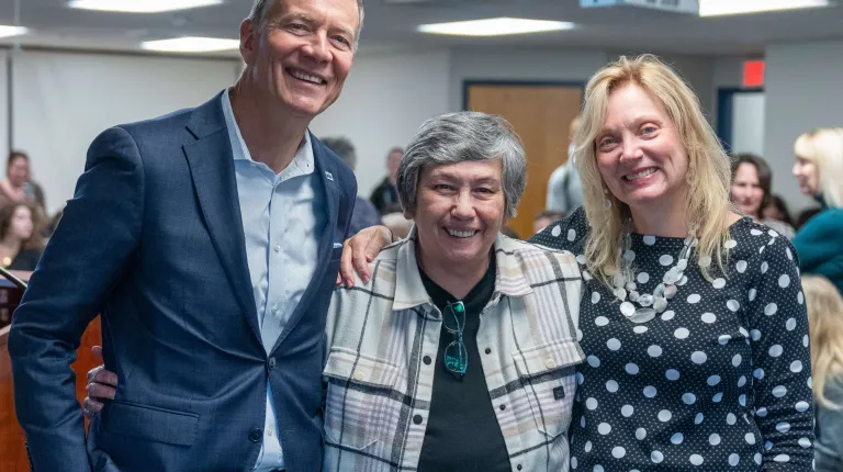 UNE President James Herbert and First Lady Lynn Brandsma pose with Donna Loring