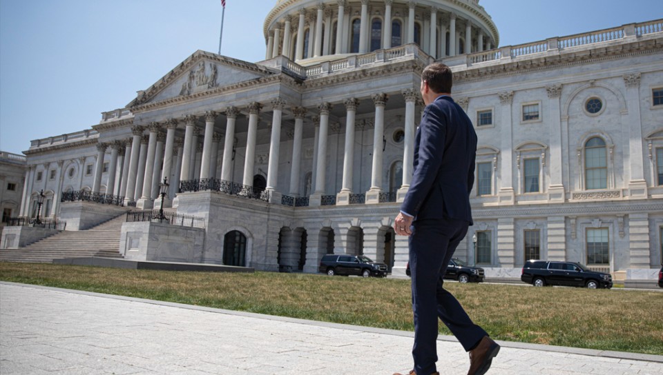 President James Herbert standing in front of the Capitol Building in Washington, D.C.