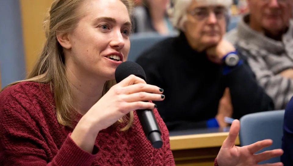 Student speaking at a UNE event