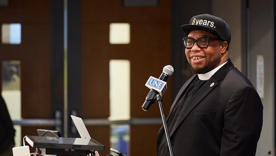 Rev. Lennox Yearwood addresses students as keynote speaker of UNE's One-Night Teach-In on Climate and Justice