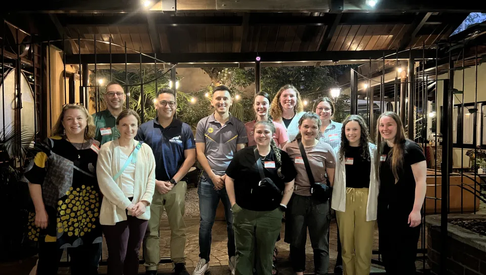 A group of students pose inside a Guatemalan restaurant