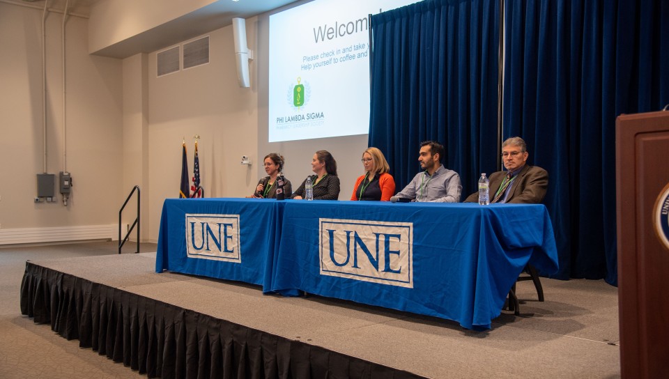 A panel of interprofessional health care practitioners gives advice to attendees