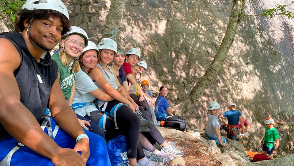 A group of students preparing to go rock climbing