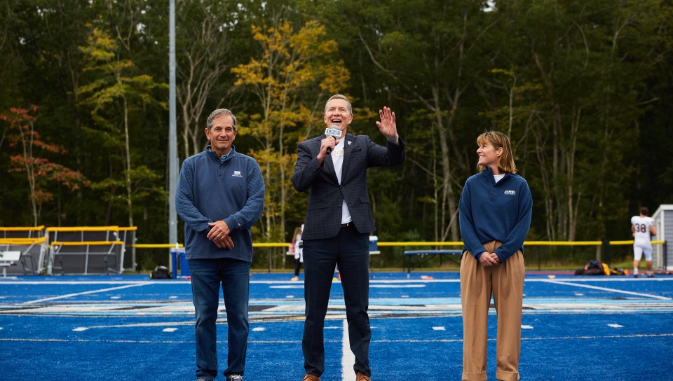 President Herbert announces the "Doing Our Part" campaign on the football field