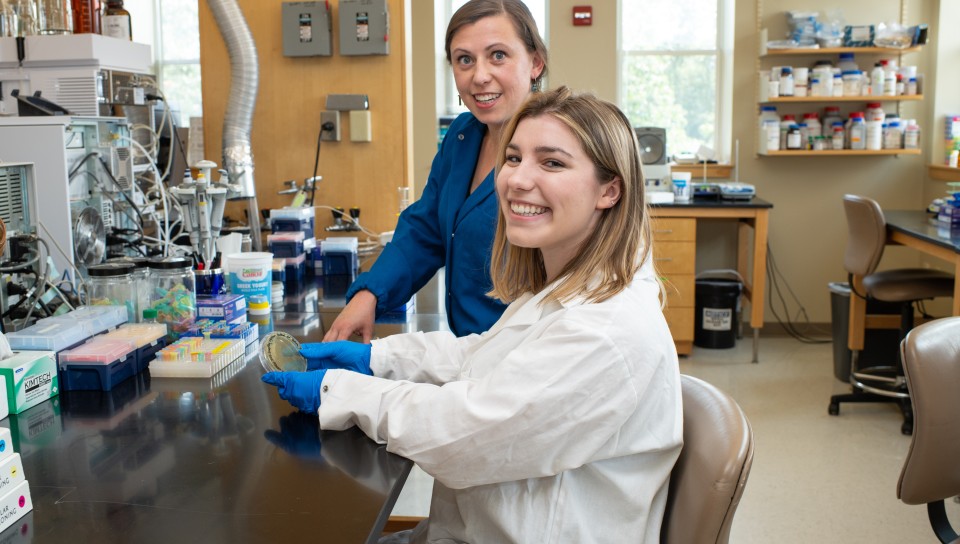 Eva Balog and a student pose for a photo while doing research in the new Portland Laboratory for Biotechnology and Health Sciences