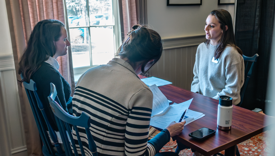 A Pharmacy student meets with prospective employers in a mock interview in Alumni Hall