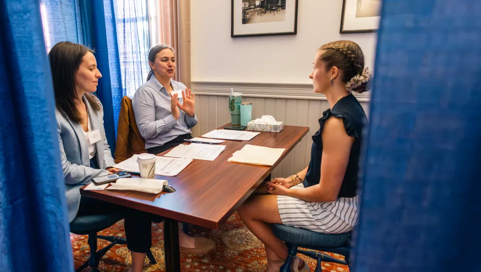 A Pharmacy student meets with prospective employers in a mock interview in Alumni Hall