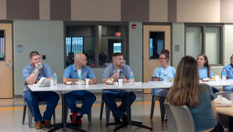 Residents of the Maine Correctional Center answer questions from UNE students.