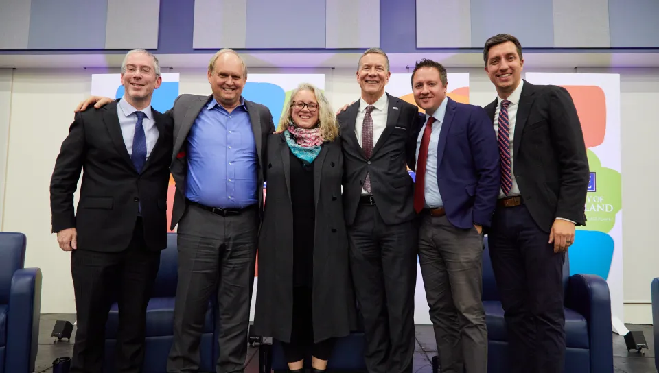 Panelists, moderator, and UNE President James Herbert and 