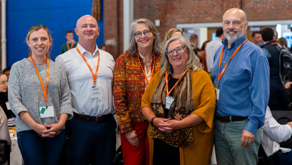 A group of UNE researchers and administrators pose for a photo