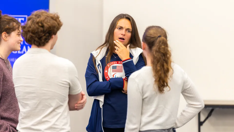 Para athlete Noelle Lambert shared her story with more than 300 UNE students. 